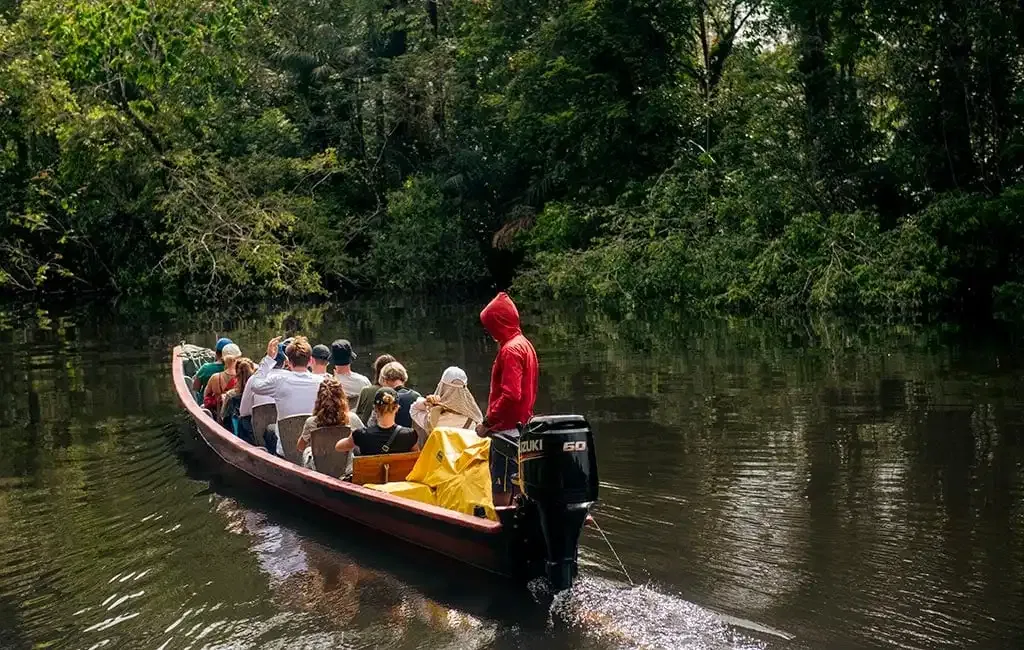 Motor canoe with tourists on the Cuyabeno River